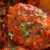 Grandma'S Meatballs · Our signature meatballs in tomato sauce over spaghetti.