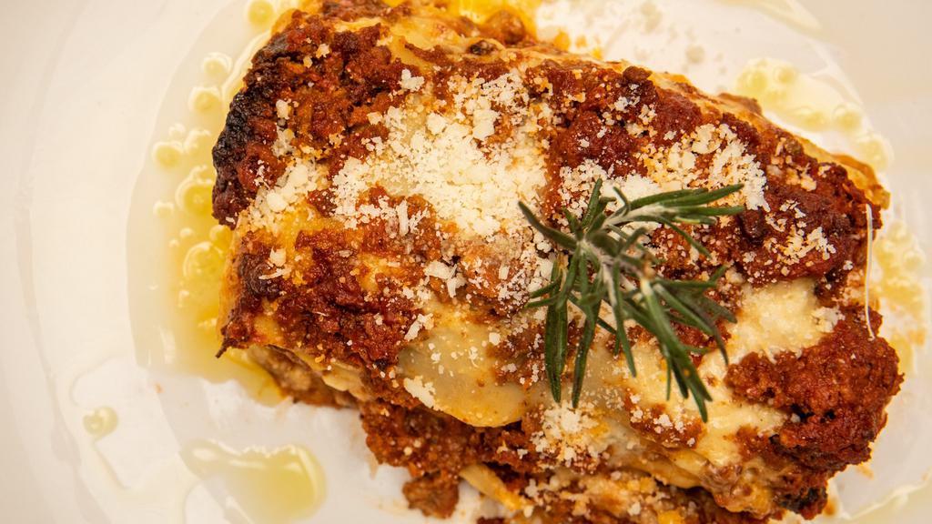 Lasagna Alla Bolognese · Grandma Eugenia's classic meat sauce with sauce bechamel.