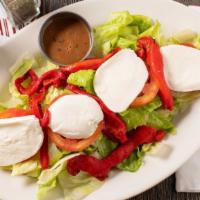 Caprese Salad · Fresh mozzarella cheese, fresh tomatoes, roasted peppers on a bed of romaine lettuce.