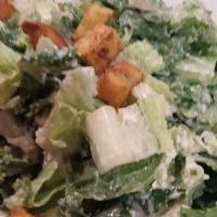 Classic Caesar Salad · Romaine hearts tossed with our famous homemade caesar dressing with croutons and romano chee...
