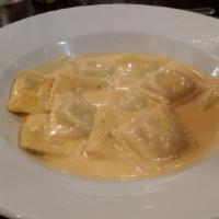 Seafood Ravioli · Homemade ravioli stuffed with crabmeat and shrimp, served in a creamy seafood pink sauce.