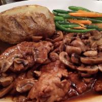 Veal Marsala · Nature veal pounded thin, sautéed with mushrooms and a rich marsala wine brown sauce.