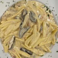 Cortecce Alla Puglia · Homemade pasta tossed with pancetta, shitake mushrooms and truffle cream sauce