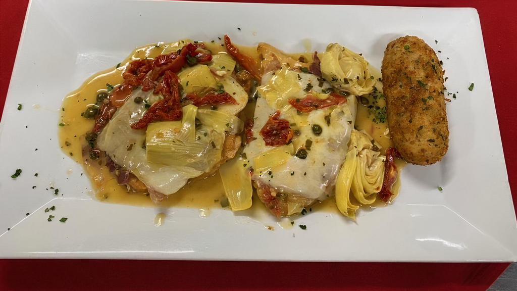 Pollo Valdostano · Chicken breast layered with prosciutto, fontina cheese, sundried tomatoes, artichoke hearts and a lemon caper sauce.