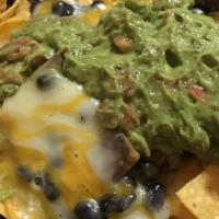 Nachos · Served With: Crispy corn tortillas smothered cheese, beans, and sour cream. Add Meats for ad...