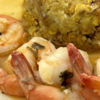 Mofongo · Mashed green plantain infused with garlic choice of steak or shrimp.