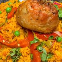 Arroz Con Pollo · Spanish saffron rice with marinated chicken breast, peppers, garden peas.
