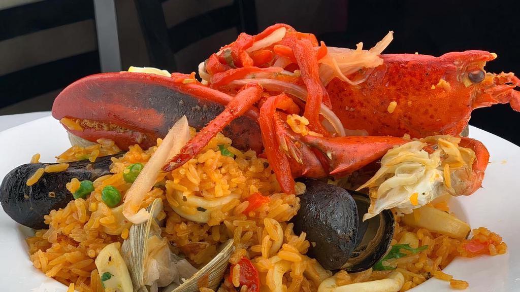 Seafood Paella · Lobster, Shrimp, Calamari, Black Mussels, Clams and Saffron Rice.