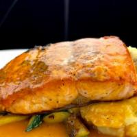 Salmon · Seared salmon served with mashed potatoes and mixed vegetables, topical lobster sauce.