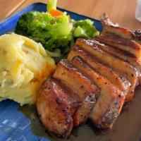 Pork Chop · Grilled Spice Rubbed Pork Chops served with Mashed Potatoes and Sauteed Vegetables with Garl...