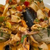 Seafood Mofongo · Mashed green plantain, shrimp, calamari, clams, mussels, creole sauce.