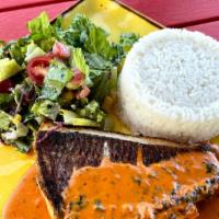 Red Snapper · Crispy whole red snapper served with coconut rice, tostones and curtido salad.