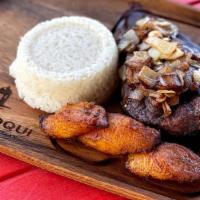 Steak & Onions (Bistec Encebollado) · Grilled ny sirloin steak topped with onions, white rice, black beans & maduros.