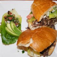 Milanesa De Res Torta · Prepared with your favorite meat breaded beef, filled with beans, mayonnaise, lettuce, tomat...