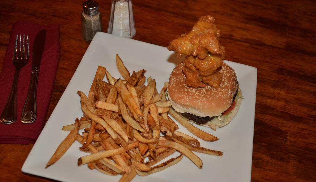 Buffalo Burgers (With Signature Fries) · 6 oz beef burger, buffalo chicken wing, melted chedder cheese, topped with buffalo sauce, lettuce, tomatoes and fried onions.