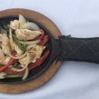 Fajitas · Gluten-free. Tender seared chicken, shrimp, steak or vegetables with grilled peppers, onions...