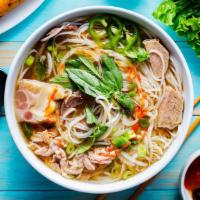 House Pho Noodle Soup 经典火车头 · Comes with Rare Eye Roud, Brisket, Tripe and Tendon, with rice noodles, served with beef bro...