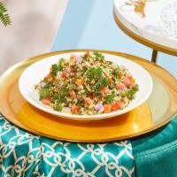 Tabbouleh · Chopped tomatoes and parsley mixed with lemon, olive oil, and bulgur wheat.