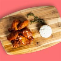 Garlic Parmesan Wing-Off · Our famous wings fried until perfectly golden and tossed in house made garlic parmesan sauce...