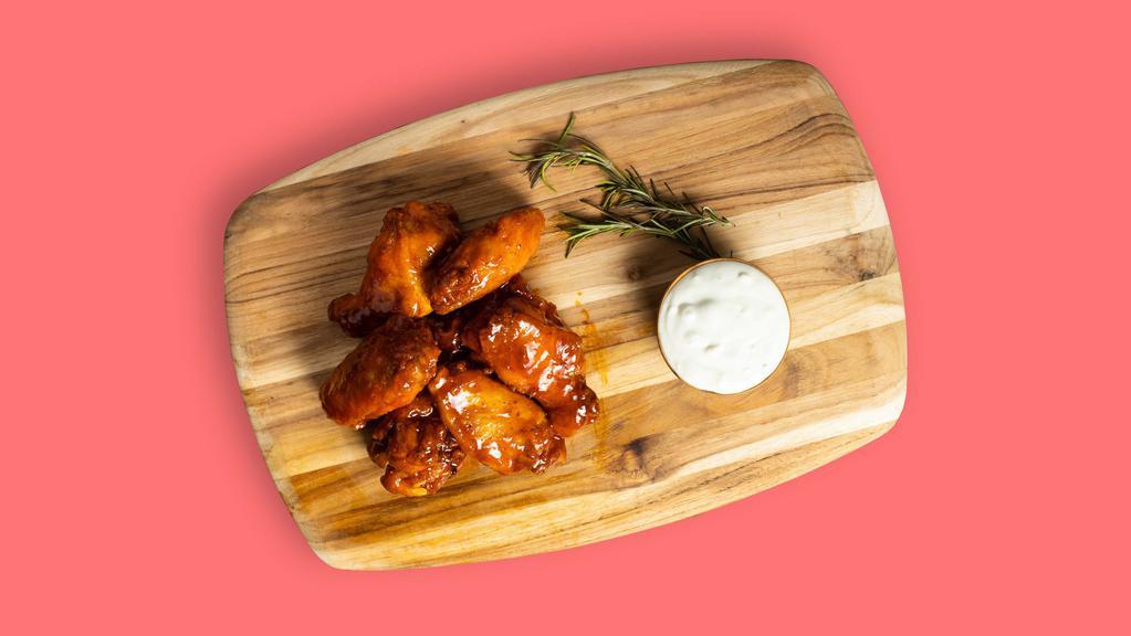 Garlic Parmesan Wing-Off · Our famous wings fried until perfectly golden and tossed in house made garlic parmesan sauce. Served with your choice of sauce and veggies