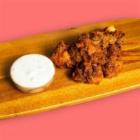 Garlic You Not · White meat chicken tenders battered and fried until perfectly golden and tossed in house-mad...