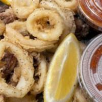 Fried Calamari · With Fra Diavolo or marinara sauce, over linguini