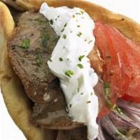 Beef & Lamb Gyro Pita Sandwich · Loaded with beef and lamb gyro, tomatoes, onions, French fries, and tzatziki or Athens sauce.