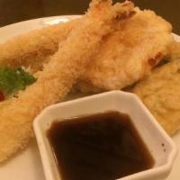 Lunch Tempura · Two pieces of shrimp and four pieces of vegetable. Served with soup or  salad.