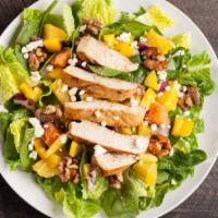 Greek Salad With Chicken · Greek styled salad with grilled chicken, feta cheese, lettuce, tomatoes, red onions, black o...