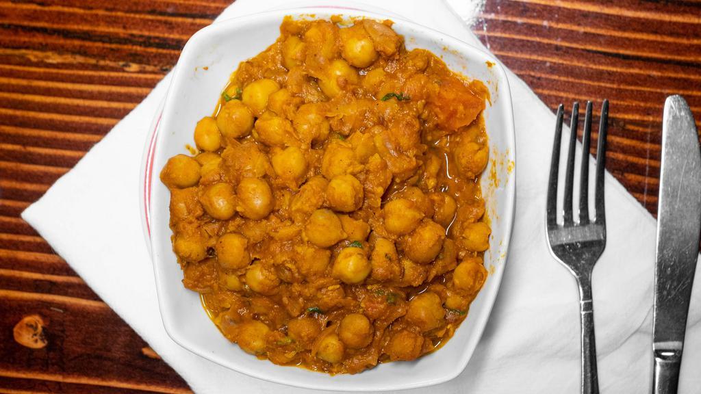 Chana Masala · Chickpeas cooked with ginger, garlic, tomato & onion spices Punjabi style.