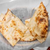 Plain Naan · A leavened flat bread made with flour is baked fresh in tandoori oven.
