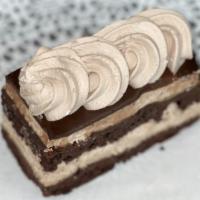 Chocolate Mousse Slice · Chocolate cake layered with chocolate mousse and topped with chocolate ganache.