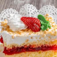 Strawberry Shortcake Slice · Vanilla sponge layered with strawberry filling, topped with fresh whipped cream.