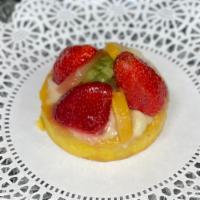 Fruit Tart Large · Italian cookie dough crust filled with vanilla custard, topped with fresh fruit.