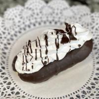 Wiped Cream Eclair · Puffed dough with fresh wiped cream, top drizzled in chocolate.
