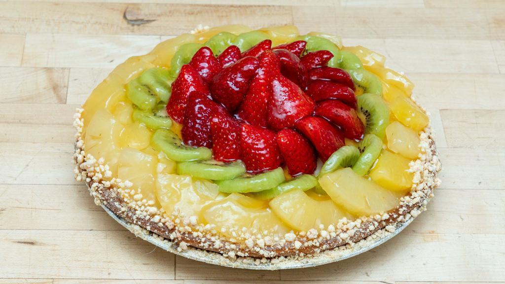 Large Fruit Tart Cake · Cookie dough crust filled with vanilla custard , vanilla sponge strawberry filling and fresh fruit.
Feeds up to 13 people
