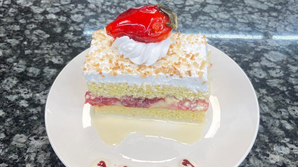 Tres Leches 8’ Cake  · 3 milks sponge cake with strawberry filling and topped with whipped cream. 8’ cake feeds 10-15 people.