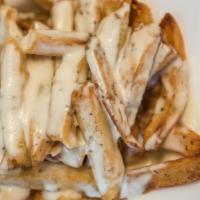 Feta Fries · Greek fries with melted feta cheese.