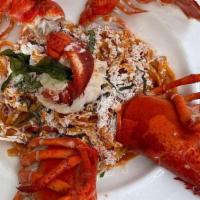 Lobster Pasta · Maine Lobster and hilopites with rich ouzo bisque.