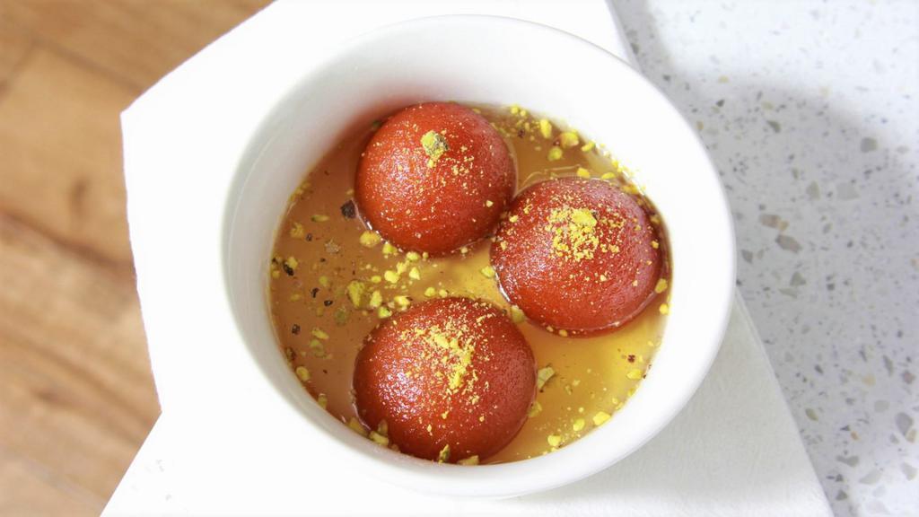 Gulab Jamoon · 2pcs,
fried cheese balls dipped in honey syrup.