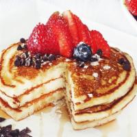 Buttermilk Pancakes · Vegetarian. 3 large fluffy buttermilk pancakes served with butter and syrup. Top them with f...