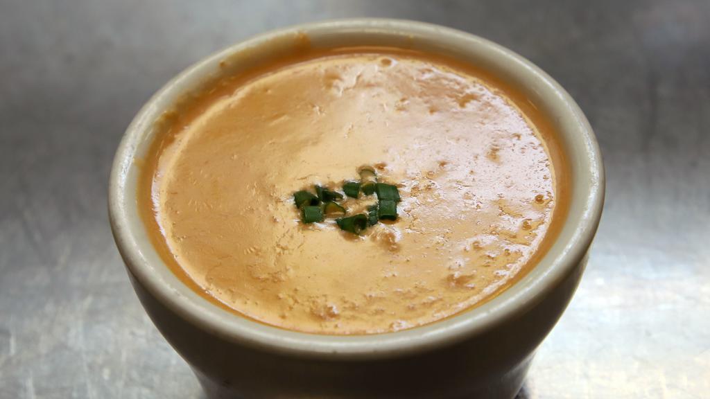 Lobster Bisque · A cup of tender Maine lobster in a rich, creamy tomato broth, cup.  Make it a bowl for a small upcharge.