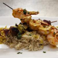 Curried Shrimp · 6 large shrimp over coconut rice with curry sauce plus sauteed vegetables.