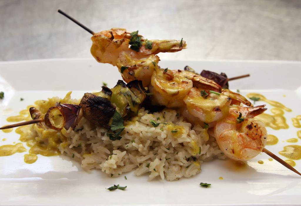 Curried Shrimp · 6 large shrimp over coconut rice with curry sauce plus sauteed vegetables.