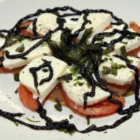Caprese Salad · Vegetarian, gluten-free. mozzarella/roma tomatoes/basil drizzled balsamic vinaigrette & oliv...
