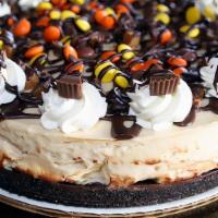 Peanut Butter Pie · Incredible beyond imagination
covered in Reese’s pieces
with chocolate fudge accents