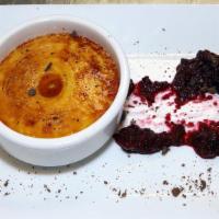 Berry Crème Bruleee · Creamy vanilla custard
topped by a seasonal berry compote
