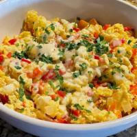 Trio Eggs + 6 Bowl · 3 scrambled eggs/home fries/peppers cheddar cheese/onions/chopped sausage and gravy. Tom D's...