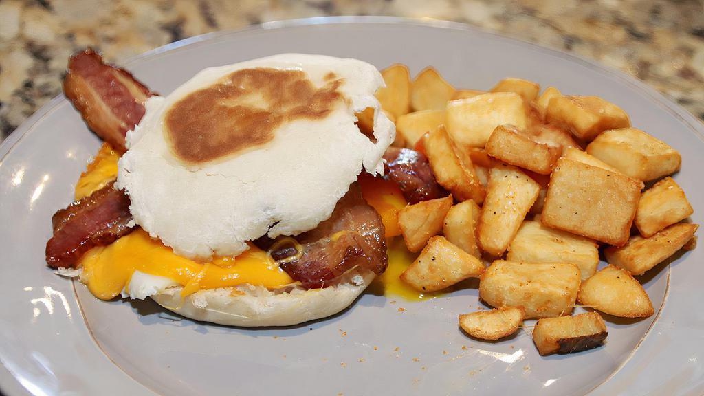 Breakfast Sandwich · an English muffin/fried egg/applewood smoked bacon/with home fries