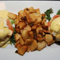 Eggs Benedict Salmon · a pair of English muffins topped with poached eggs/hollandaise sauce/delicious smoked salmon